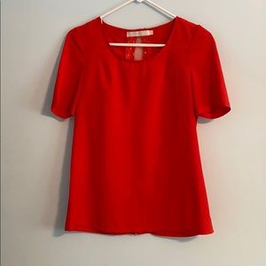 Red blouse with black bows down the back!